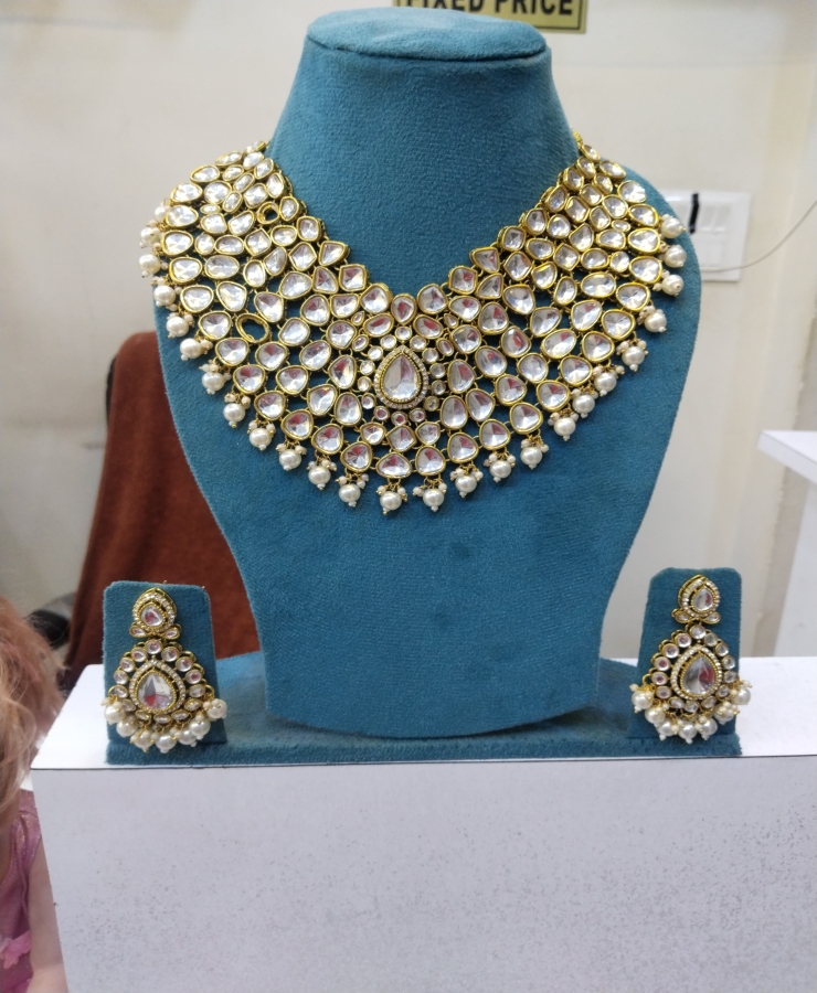 Golden touch Kundan white moti set